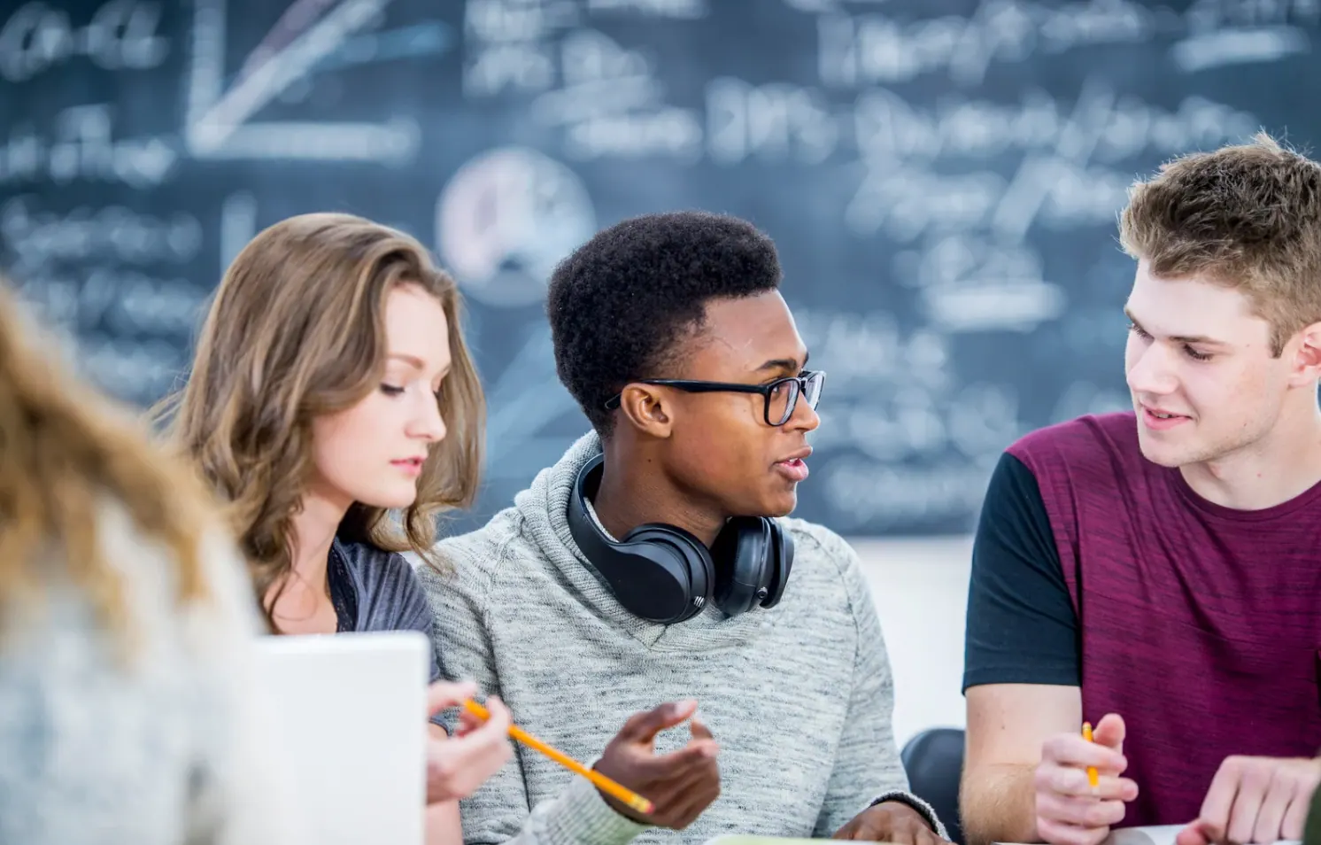 Students collaborating in a classroom discussion group